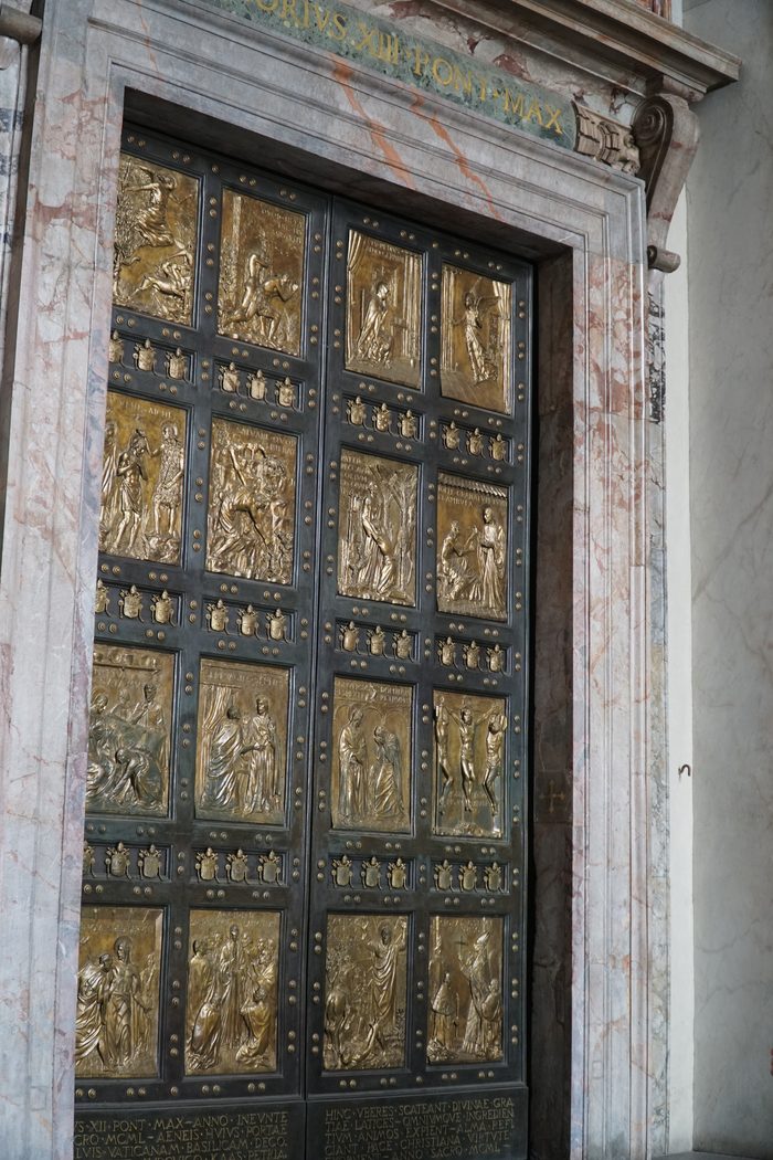 The bronze Holy Door of St. Peter's Basilica, Rome, its panels cast with scenes of mercy and return